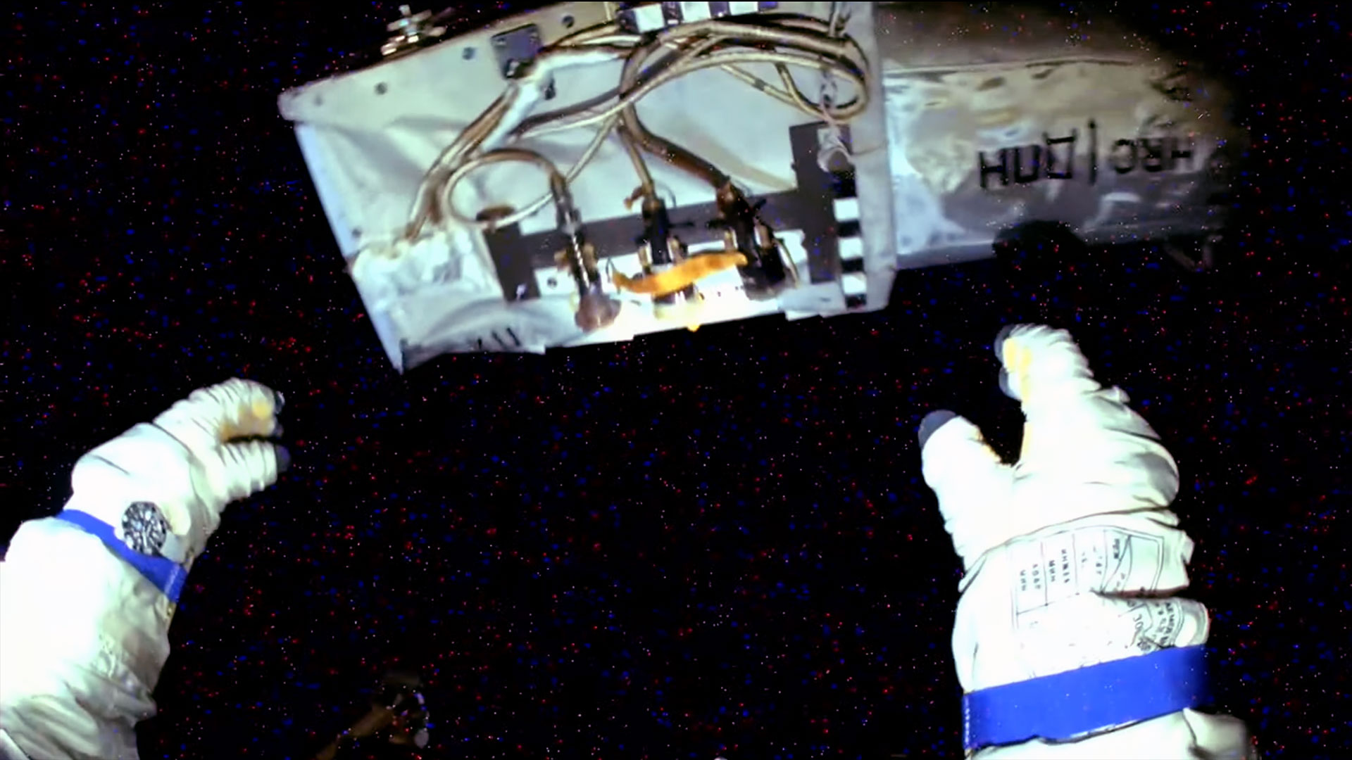 a camera mounted on the helmet of a cosmonaut&#039;s spacesuit captured this view of the cosmonaut&#039;s hands after he jettisoned a camera unit into the vacuum of space.