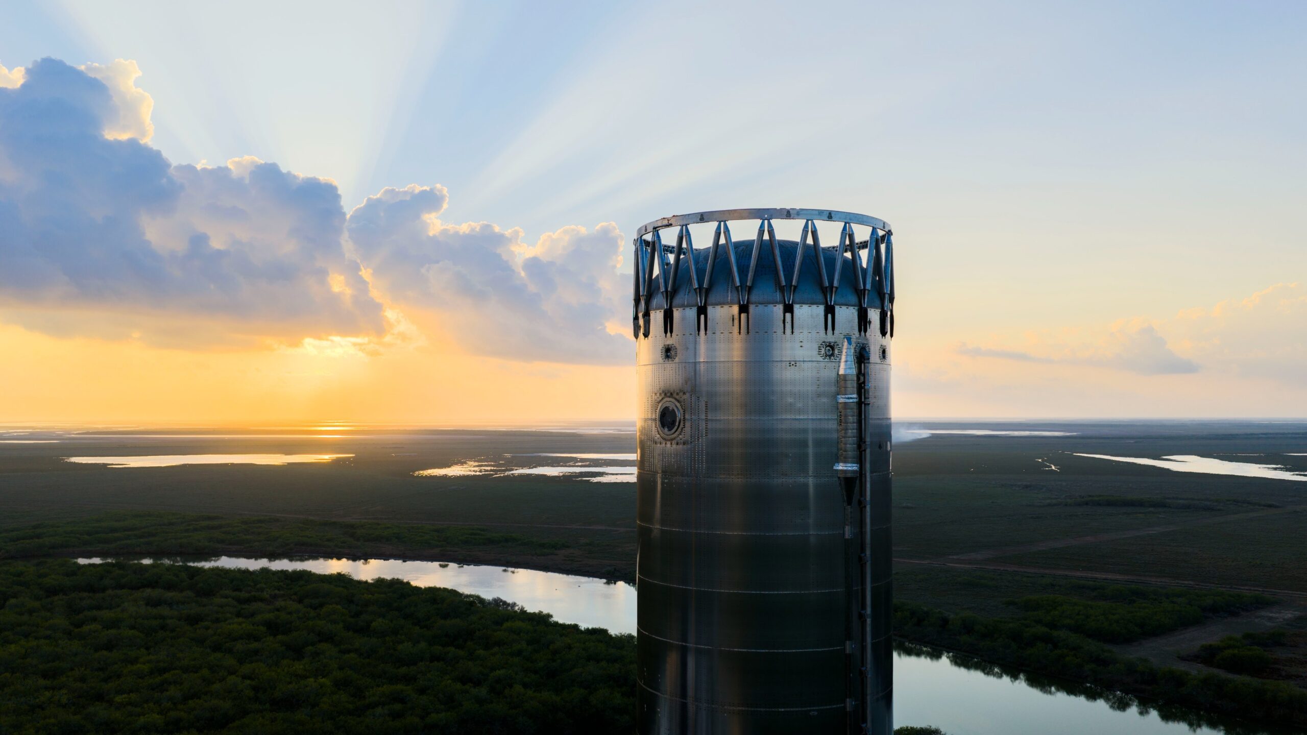 A giant chrome cylinder fashioned into a rocket booster