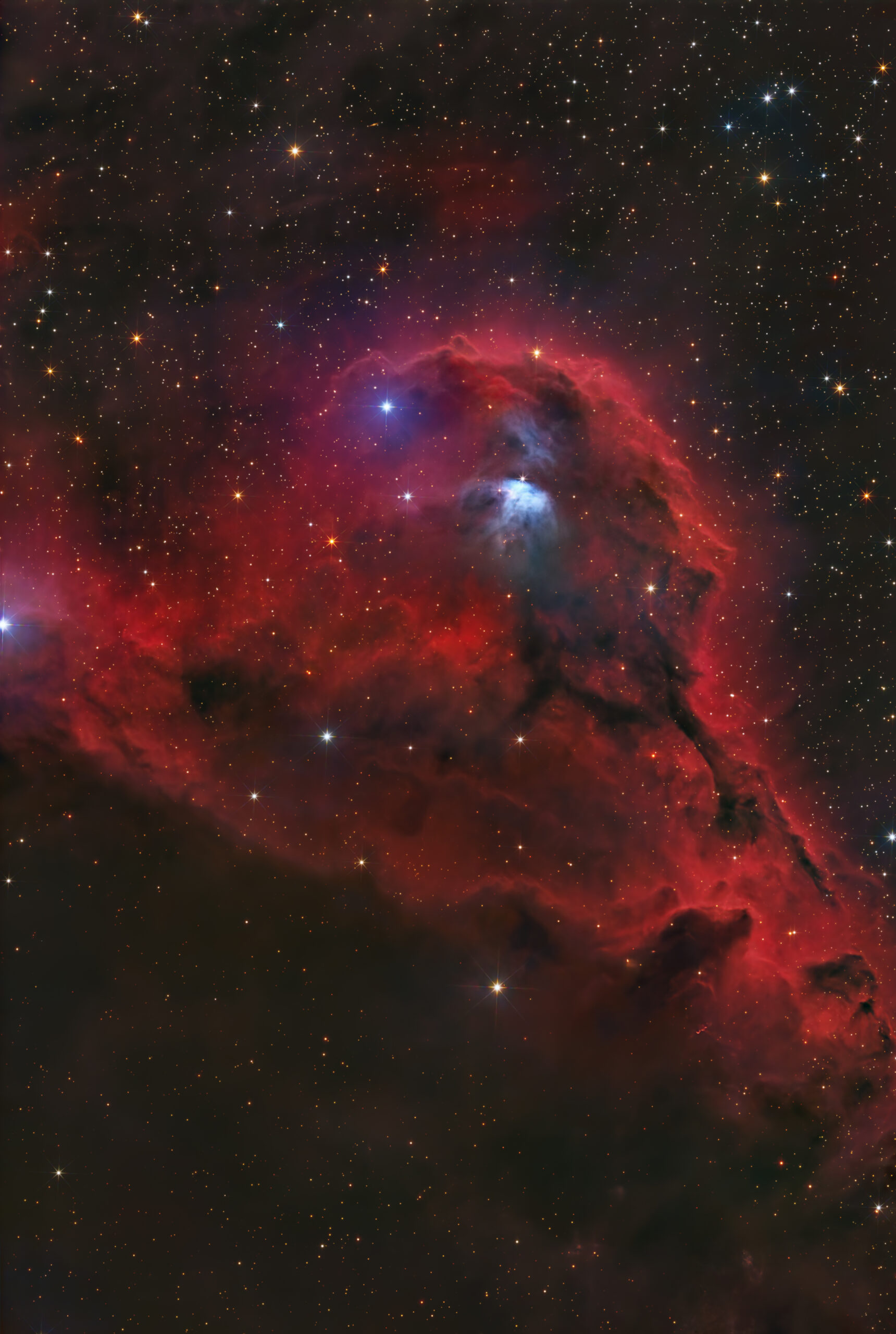 a bright red cloud of dust on a starry background