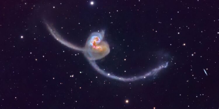 Astrophotographer captures spectacular photo of Antennae Galaxies dueling in deep space