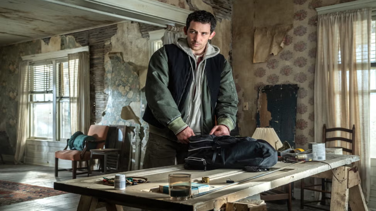 a man in a house unloading a backpack