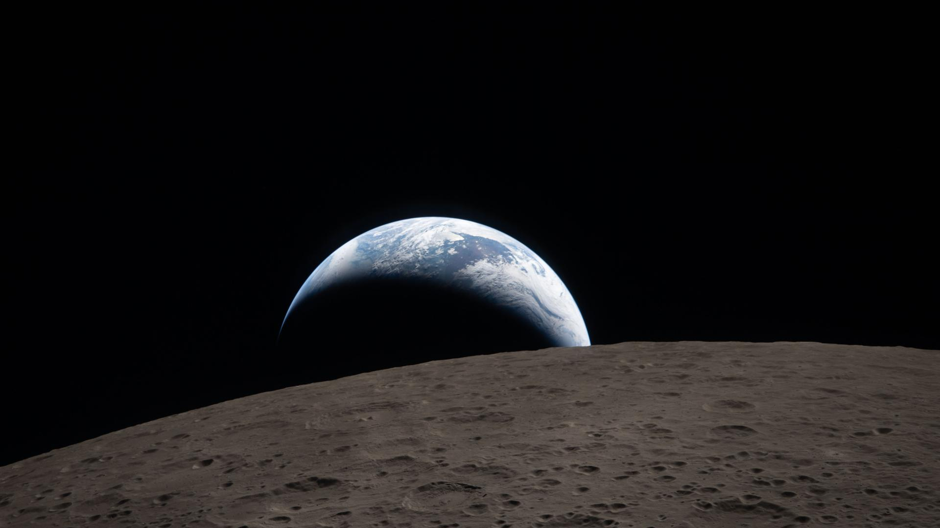 Earthset captured through the Orion spacecraft window at 6:41 p.m. EDT, April 6, 2026, during the Artemis 2 crew&amp;rsquo;s flyby of the Moon