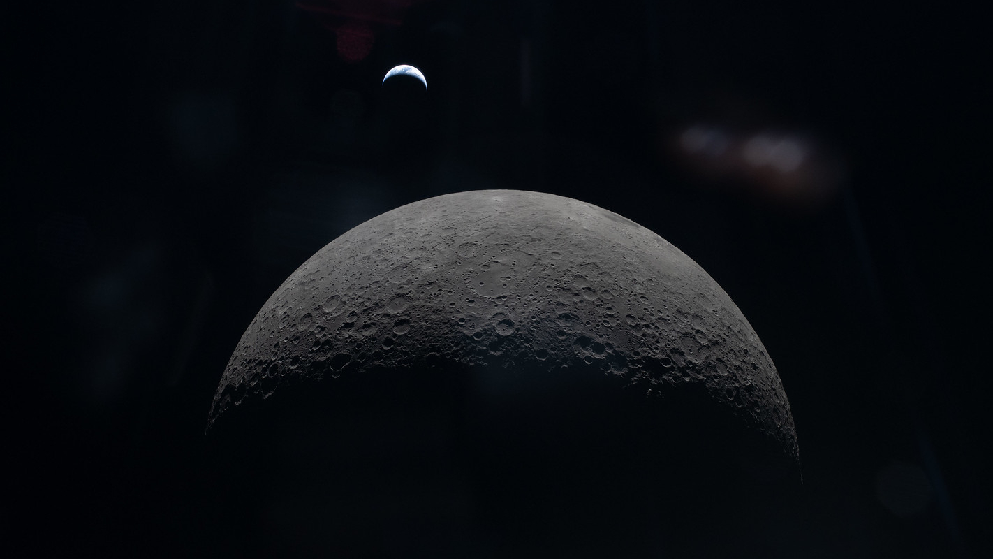 A photo of the crescent moon taken from a spacecraft, with the crescent Earth visible above the lunar horizon, hanging in the blackness of space.