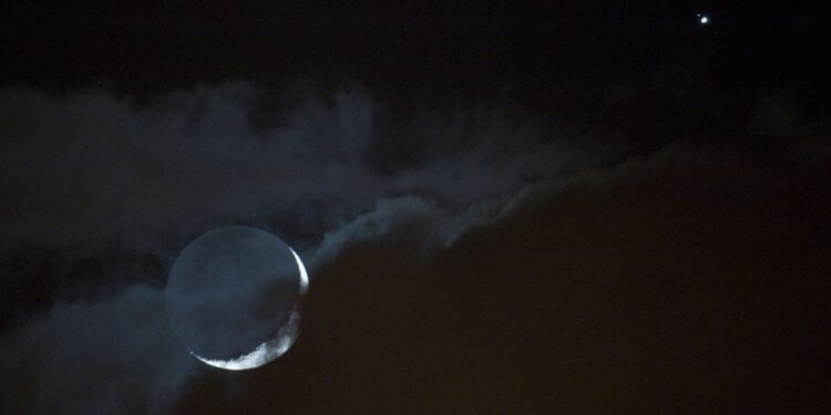 See Jupiter glow beside the waxing moon after sunset on May 20